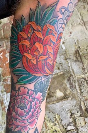 Leaves coming off a Japanese chrysanthemum on my inner left arm. 