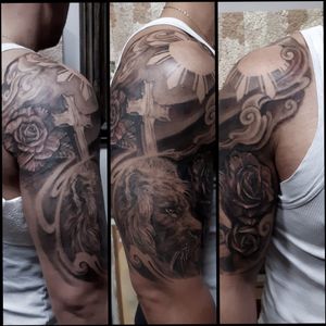 Custom Half sleeve tattoo#clydelaudato #liontattoo #rosetattoo #crosstattoo #philippinesun #blackandgreytattoo 