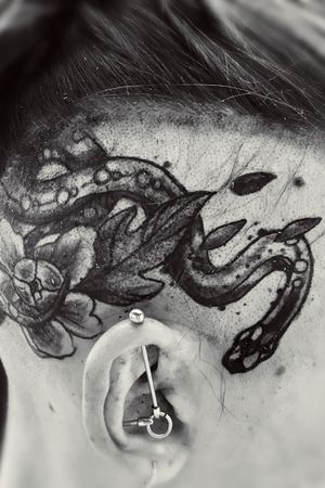 Snake on a head tattoo 