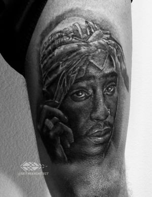 2Pac portrait on top of thigh.