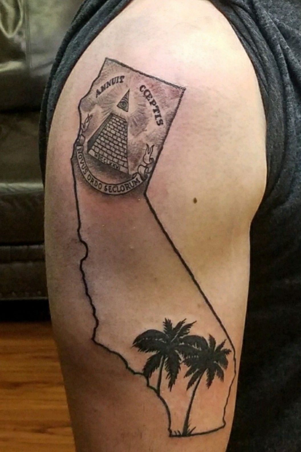 California themed tattoo done on the tricep