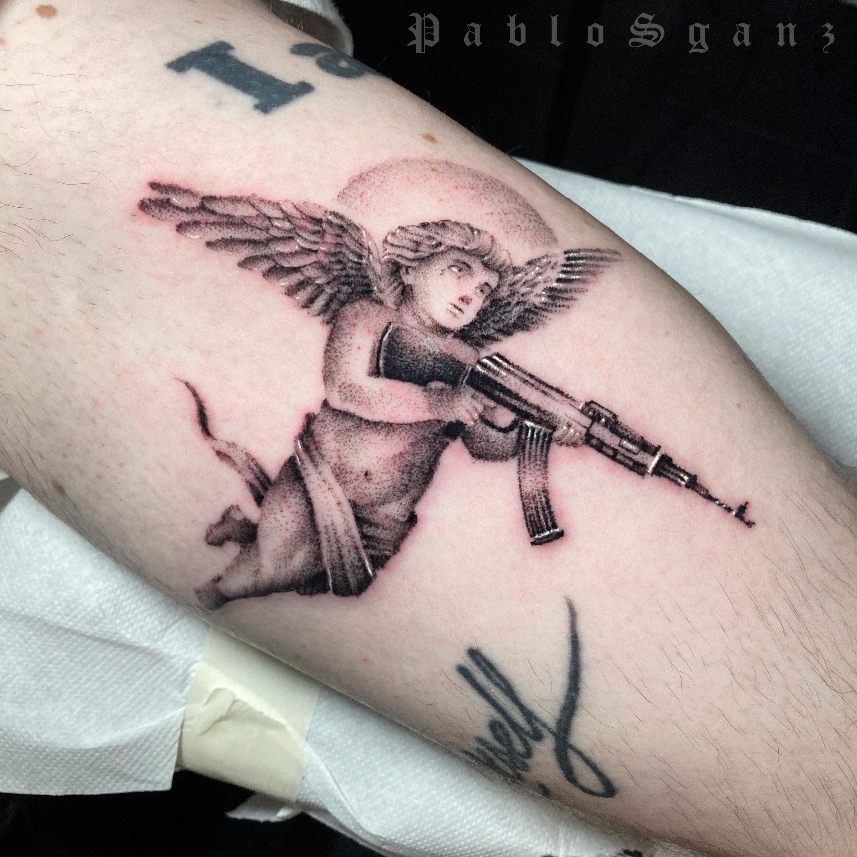 Understanding the Meaning Behind Angel with AK47 Tattoo A Detailed Guide   Impeccable Nest