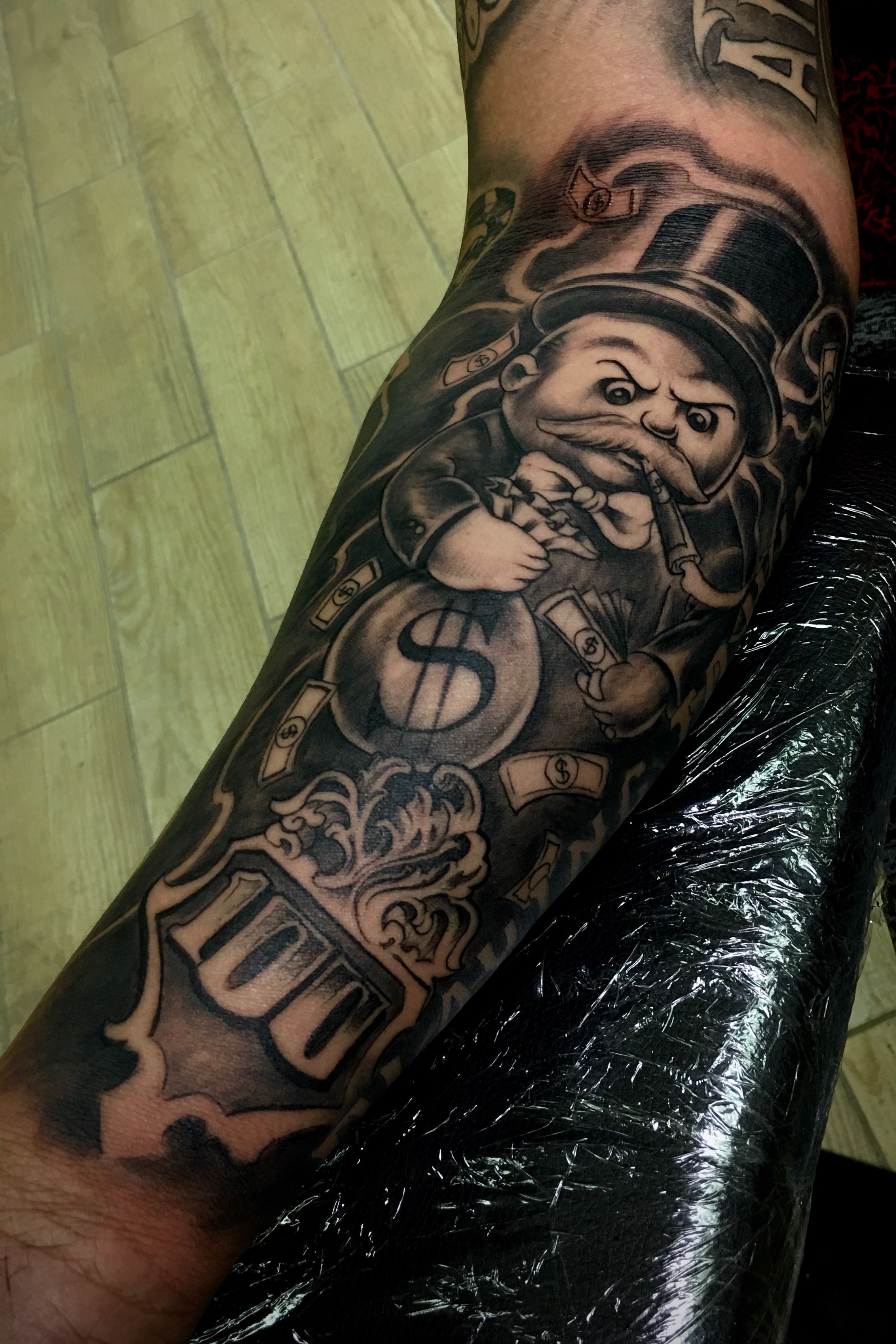 monopoly man tattoo