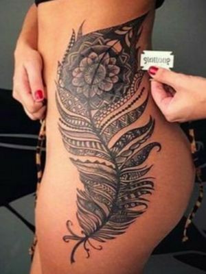 Feather thigh tattoo