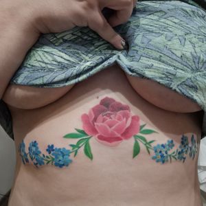 Beautiful underboob flower tattoo #peonyflower #peony #peonytattoo #peonywatercolor #watercolor #forgetmenottattoo #forgetmenots #forgetmenotflower
