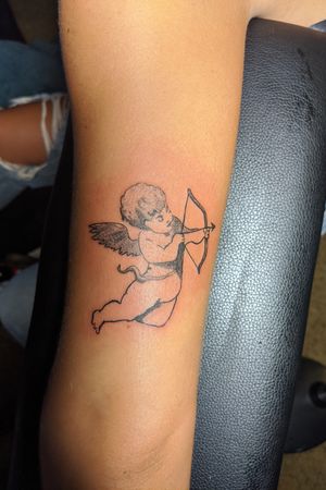 Little baby Cupid tattoo. 