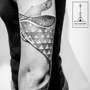 Elegant upper-arm tattoo featuring a unique dotwork pattern design by Chasinghawk Tattoos. Perfect for those seeking a one-of-a-kind piece.