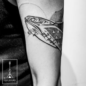 Experience the beauty of the sea with this stunning dotwork tattoo on your upper arm. Meticulously done by Chasinghawk Tattoos.