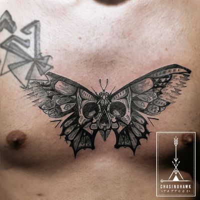 Butterfly Skull Sternum Tattoo