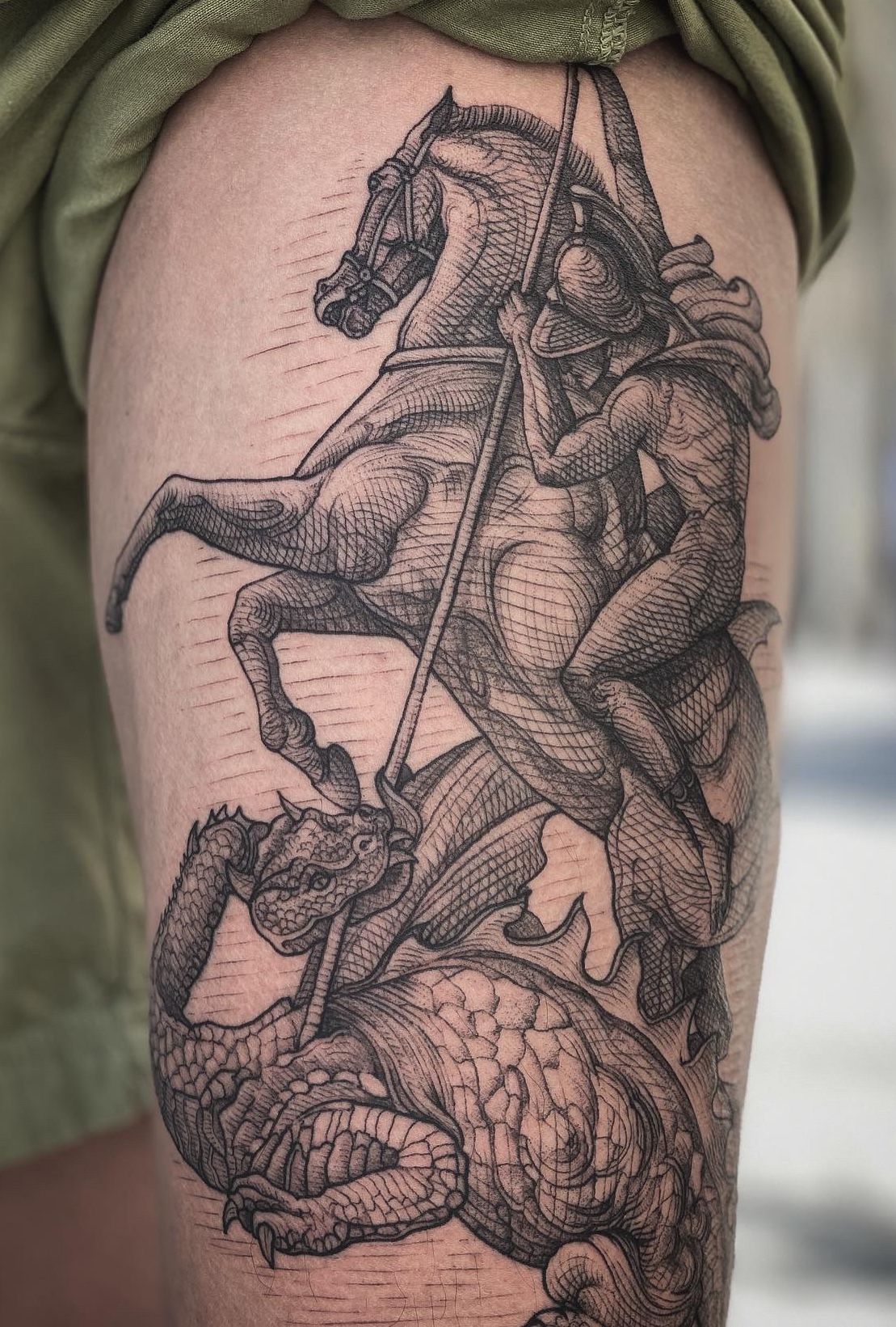 Saint George tattoo located on the chest black and