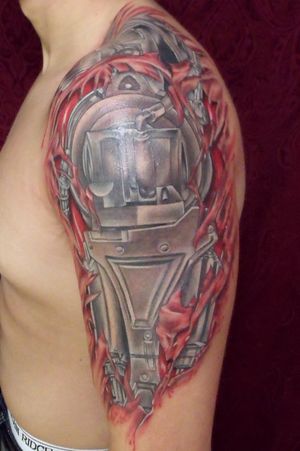 Terminator T800 robot under ripped skin tattoo by Mike
