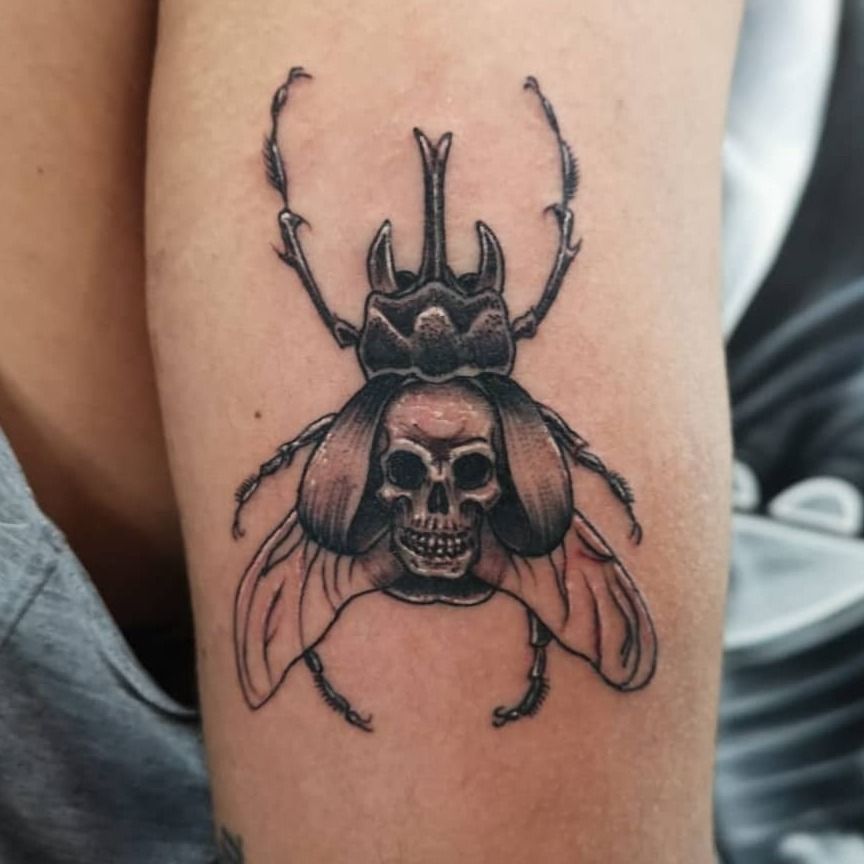 Beautiful beetle tattoo on the right side