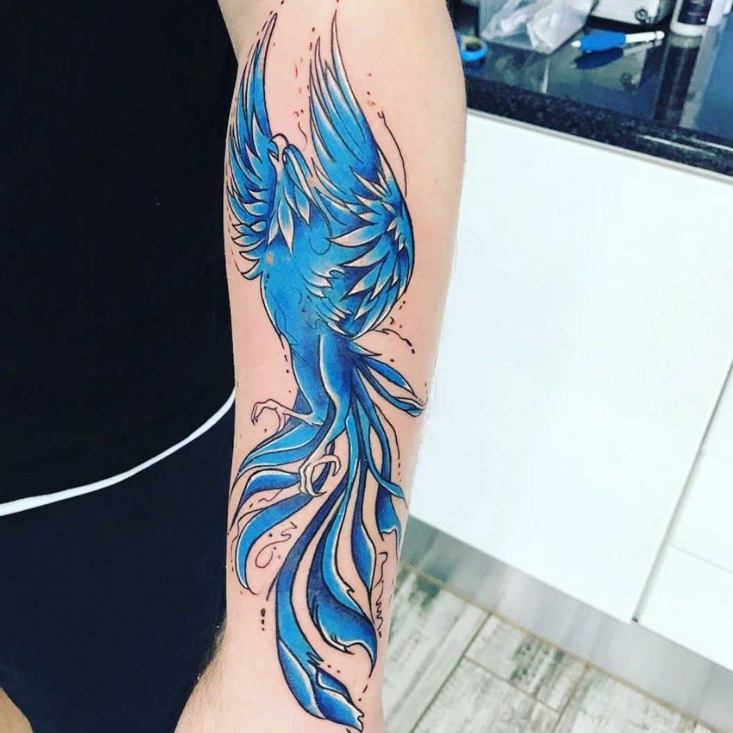 Tattoo uploaded by Luke Holmwood  Left arm blue fire Phoenix  Tattoodo