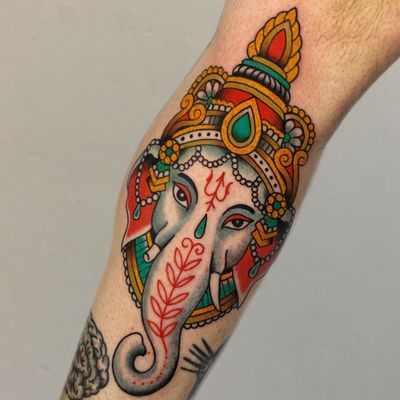 Experience the power and wisdom of Ganesha with this neo-traditional illustrative tattoo by Andrea Furci on your lower leg.