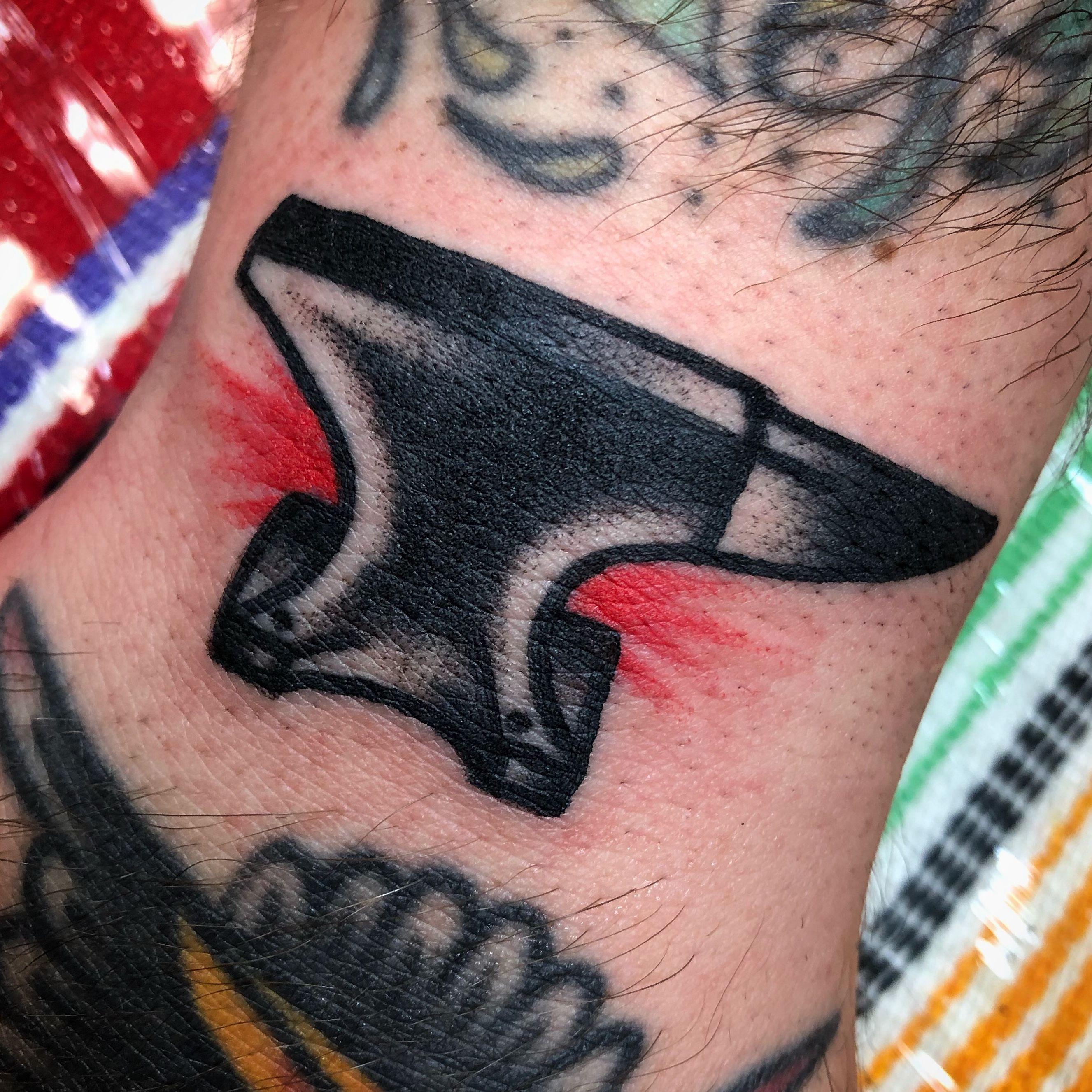 tattoo of a small hatchet axe on the forearm - Arthub.ai