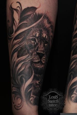 Black and grey realistic lion on firearm 