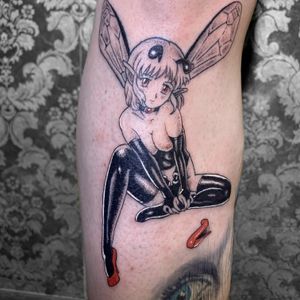 Get inked on your arm with a stunning anime girl design featuring a collar, chocker, socks, and wings by tattoo artist Galen Bryce (aka Drip Skull).