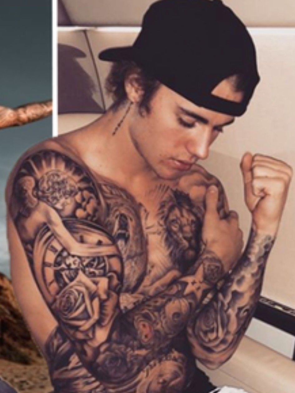 Justin Bieber shows off his new wreath chest tattoo wearing nothing but a  towel see pics