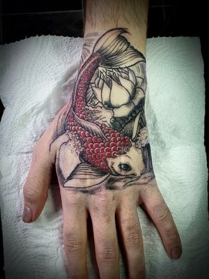 Start of a Japanese sleeve tattoo we started with the koi hand tattoo 