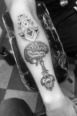 Brain tattoo done by Graham Niles at Lifetime Tattoo in Denver, CO. #brain #key #abstract #geometric #black #line #linework #pl #prettylights