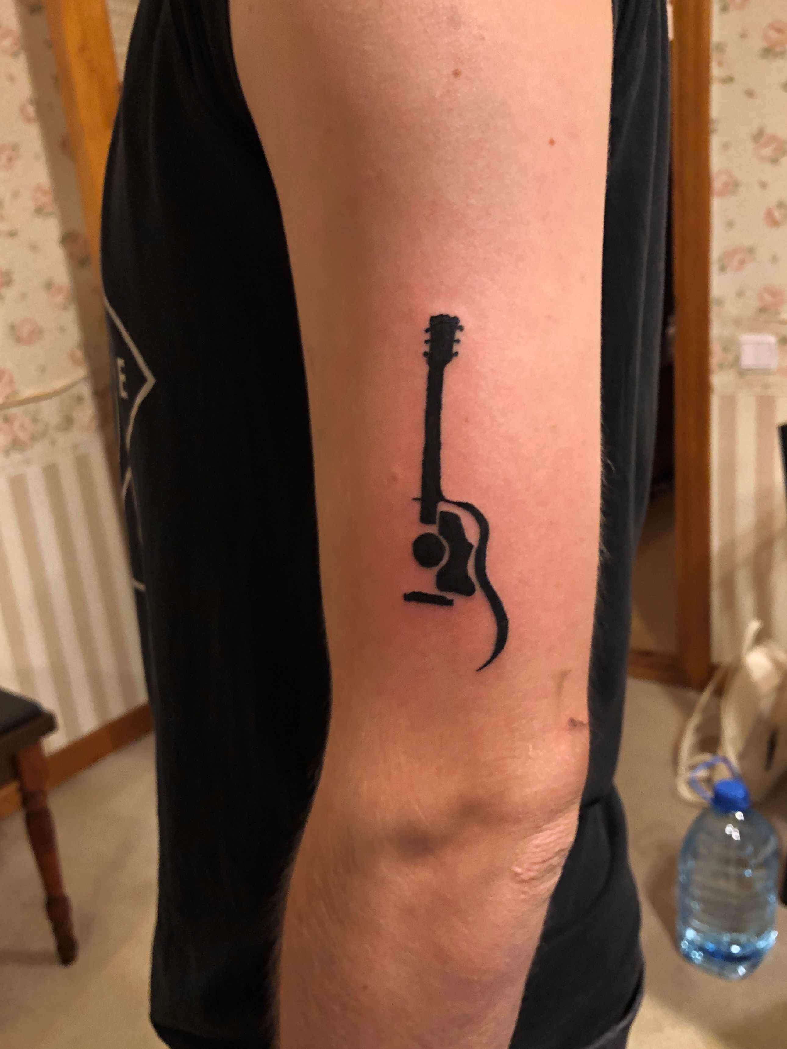 Black and grey guitar tattoo