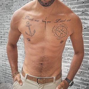 Anchor, compass, cross, text sketch technique tattoo. 