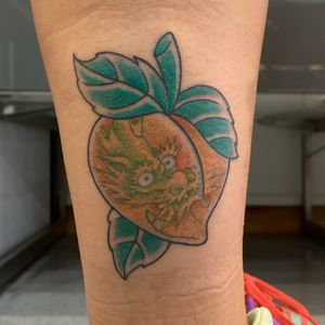 Peach with a dragon tattooed 