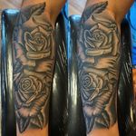 Black and gray roses on inner forearm clients first tattoo