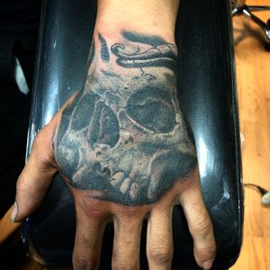 Skull on hand black and gray
