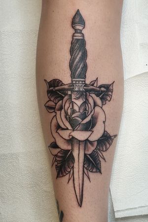 Traditional shin dagger and rose tattoo 