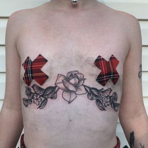 Floral black and grey sternum tattoo