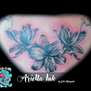 Realistic lilies tattoo #tattoo #tattoos #freshink #freshlyinked #blackandgreytattoo #blackandgrey #realistic #realistictattoo #inkwell #girltattoo #lilly #lily #lillytattoo #lilies