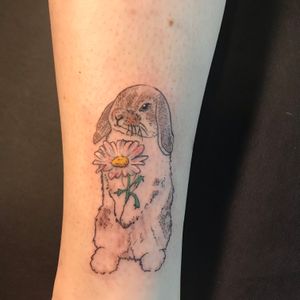 Custom bunny tattoo above the ankle with a hint of color. 