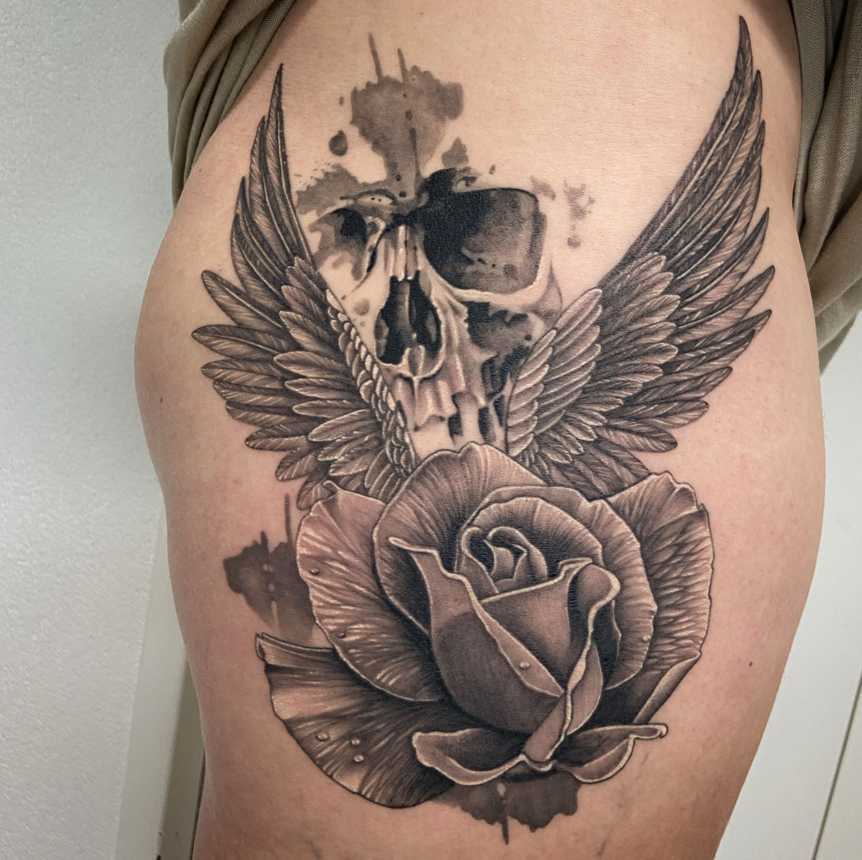 skull with wings and roses