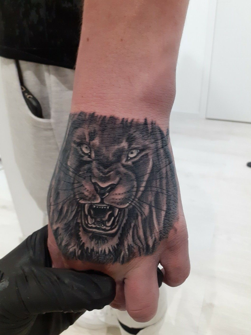 Premium Photo | Bold Lion Tattoo Design On Gray Background