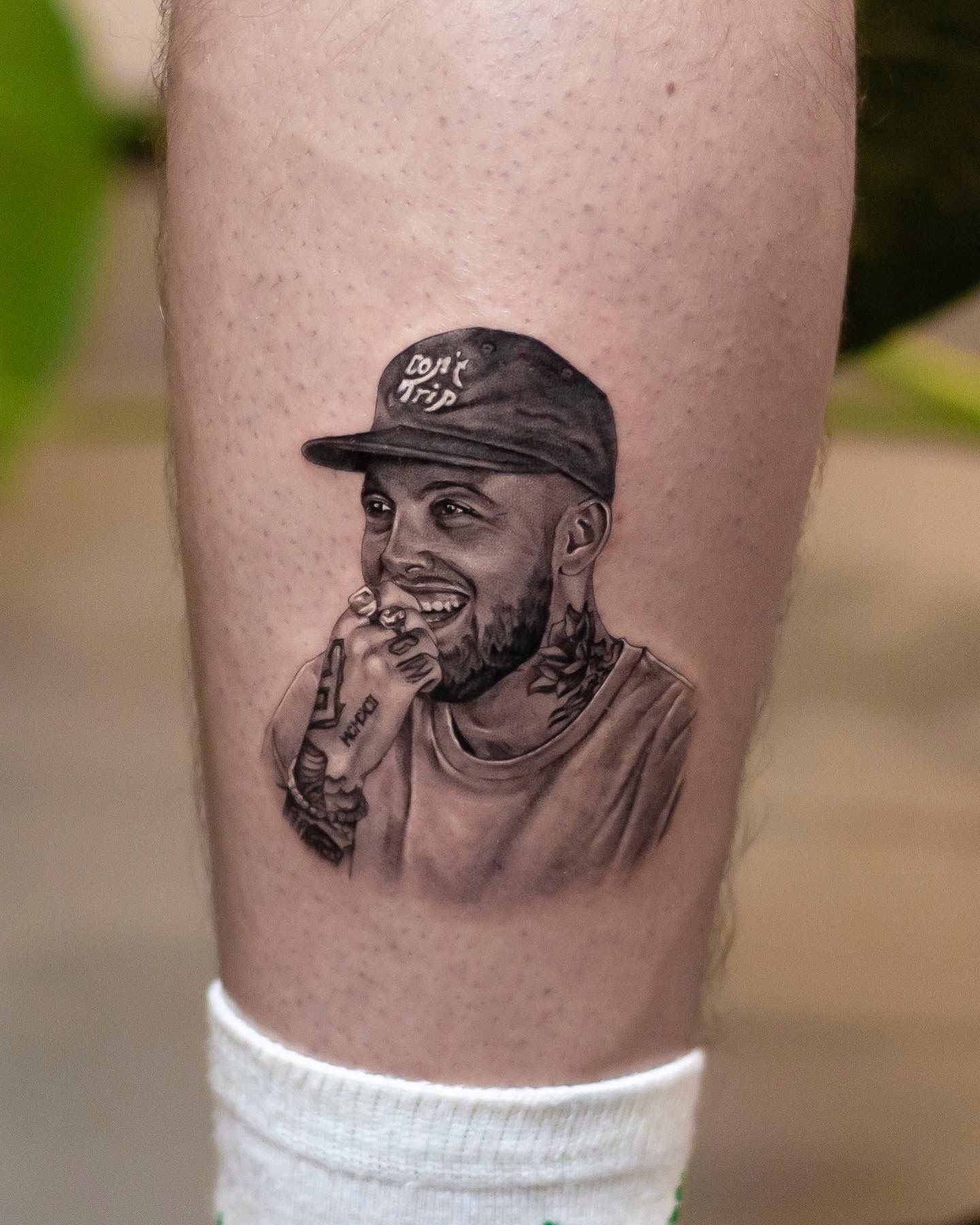 Micro-realist Mac Miller tattoo on inner forearm