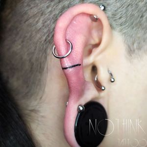 Small ear line handpoke tattoo