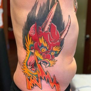 Traditional demon on the ribs by Shane Vick