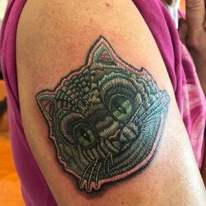Custom patch style tattoo of the Cheshire Cat. 