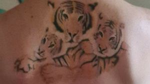 Mama Tiger with her Cubs..This represents myself and my X2 boys.Design and Tattoo done by my cousin in his own home studio