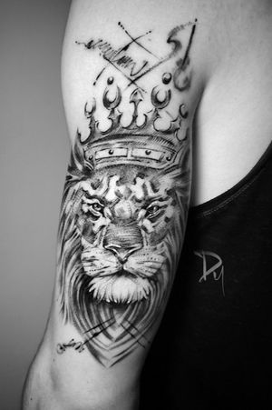 Sketch style lion with crown tattoo 