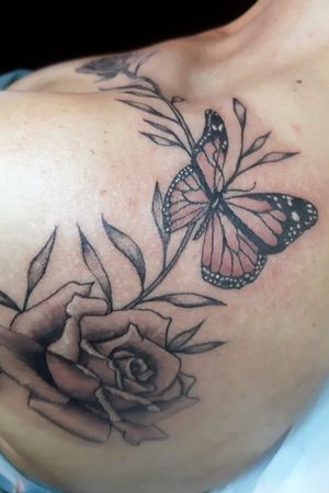 Realistic flowers and butterfly with some subtle pink color in it.