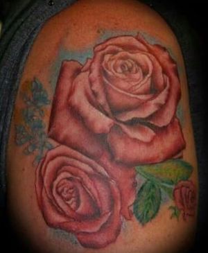 Roses that were designed and arranged on photoshop by an old fellow co worker of mine. Which I had the pleasure of tattooing the design. 