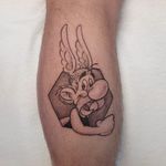 Asterix cartoon tattoo on calf