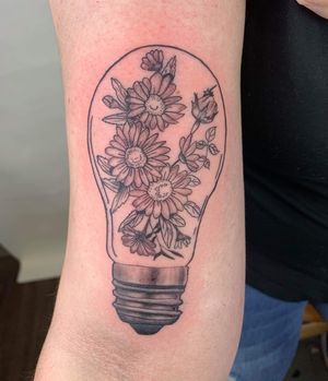 Flowers in light bulb