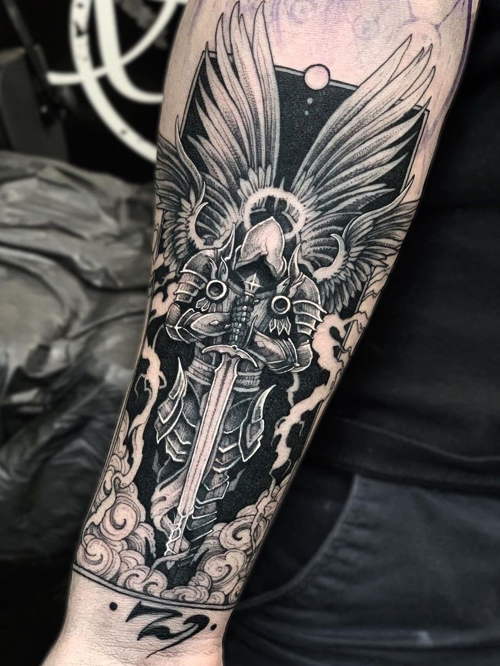 Micro-realistic Archangel Michael tattoo on the