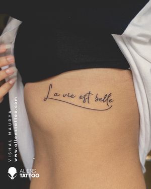 Script Tattoo by Vishal Maurya at Aliens Tattoo India   La vie est belle is a French expression meaning life is beautiful , This tattoo is an example of minimal and aesthetic line work which totally steals your heart at first glance.