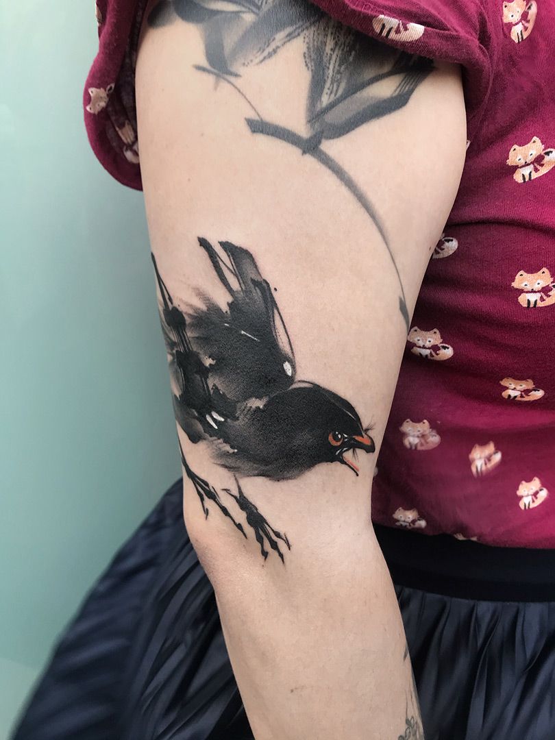 Tattoo art with stylized black bird silhouette Vector Image