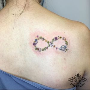 Floral & Saturn Infinity Fine-line Colour Tattoo by Kirstie @ KTREW Tattoo - Birmingham, UK #finelinetattoo #floraltattoo #tattoos #infinity #birmingham