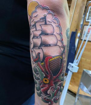 Kraken tattoo on the back side forearm area